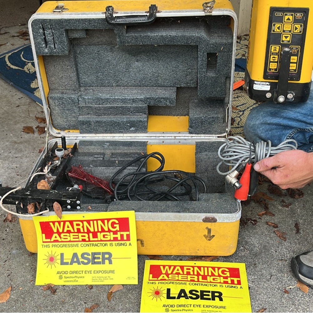 Laser beam land survery machine